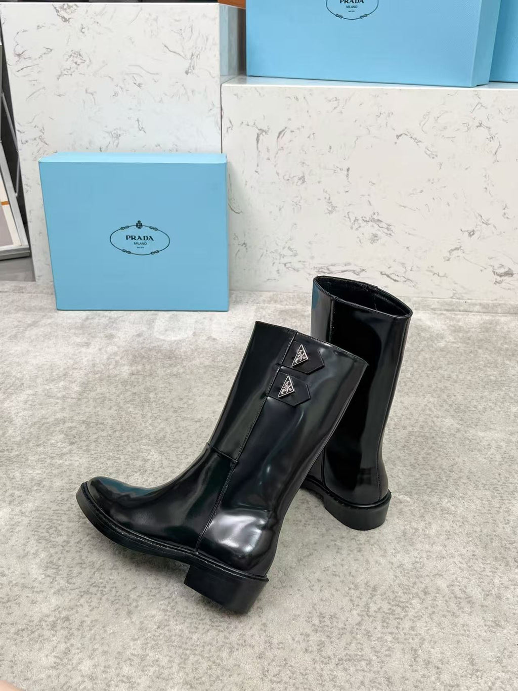 Black patent leather mid-calf boots
