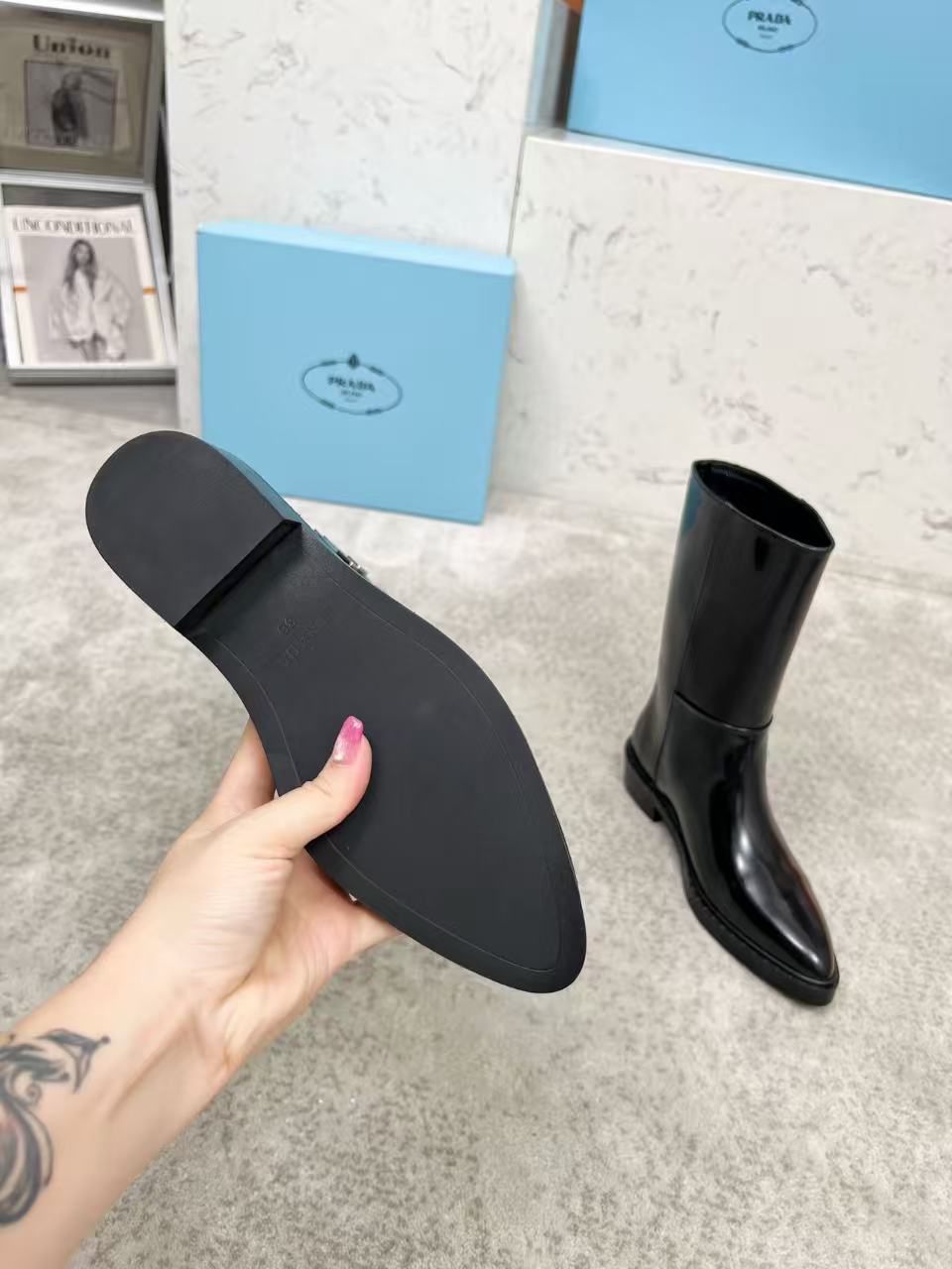 Black patent leather mid-calf boots